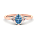 Load image into Gallery viewer, petite-bezel-set-oval-shaped-vivid-blue-engagement-ring-in-rose-gold-fdenr9175ovgvbluesleep-nl-rg.jpg