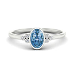 Load image into Gallery viewer, petite-bezel-set-oval-shaped-vivid-blue-engagement-ring-in-white-gold-fdenr9175ovgvbluesleep-nl-wg.jpg