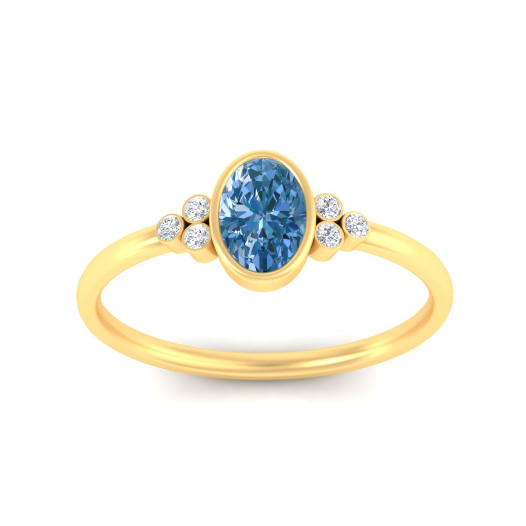 petite-bezel-set-oval-shaped-vivid-blue-engagement-ring-in-yellow-gold-fdenr9175ovgvblueangle5-nl-yg.jpg