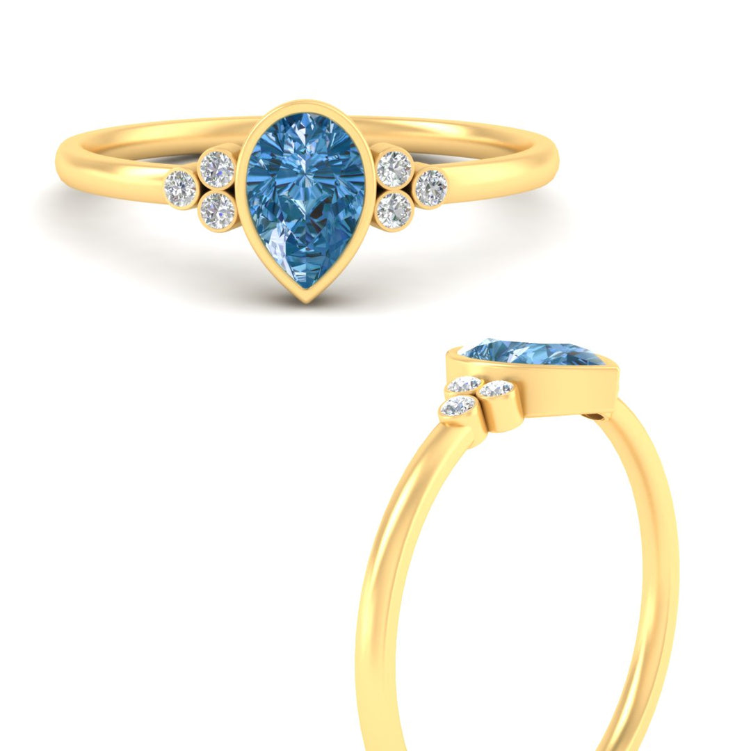petite-bezel-set-pear-shaped-vivid-blue-engagement-ring-in-yellow-gold-fdenr9175pegvblueangle3-nl-yg.jpg