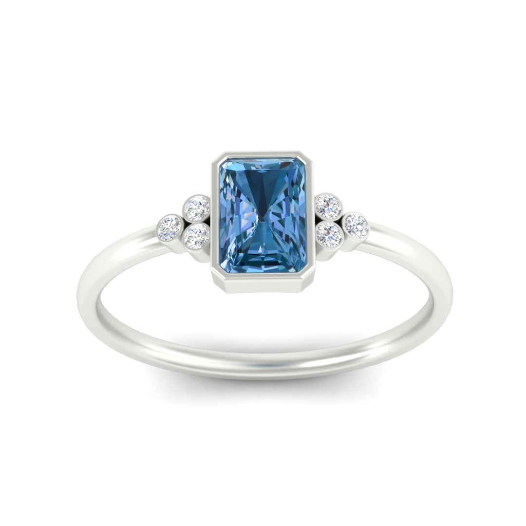 petite-bezel-set-radiant-cut-vivid-blue-engagement-ring-in-white-gold-fdenr9175ragvblueangle5-nl-wg.jpg