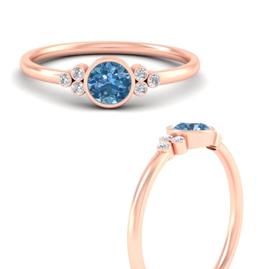 petite-bezel-set-round-cut-vivid-blue-engagement-ring-in-rose-gold-fdenr9175rogvblueangle3-nl-rg.jpg