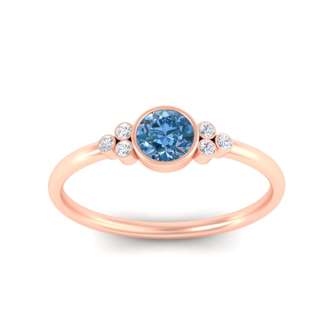 petite-bezel-set-round-cut-vivid-blue-engagement-ring-in-rose-gold-fdenr9175rogvblueangle5-nl-rg.jpg