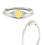 Load image into Gallery viewer, petite-bezel-set-round-cut-vivid-yellow-engagement-ring-in-white-gold-fdenr9175rogvyellowangle3-nl-wg.jpg