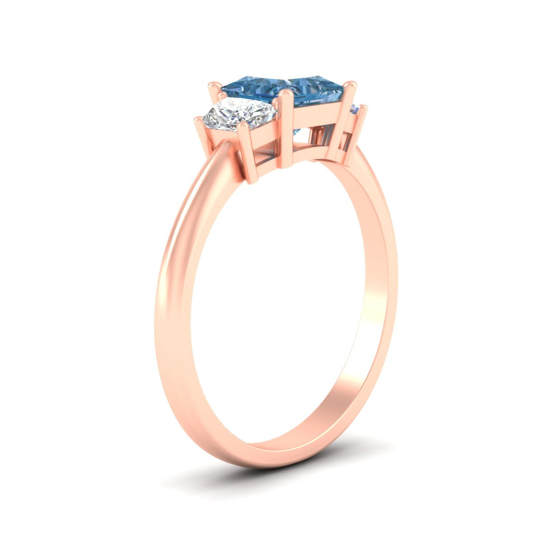 princess-cut-vivid-blue-trapezoid-engagement-ring-in-rose-gold-fdenr7981prgvblueangle2-nl-rg.jpg