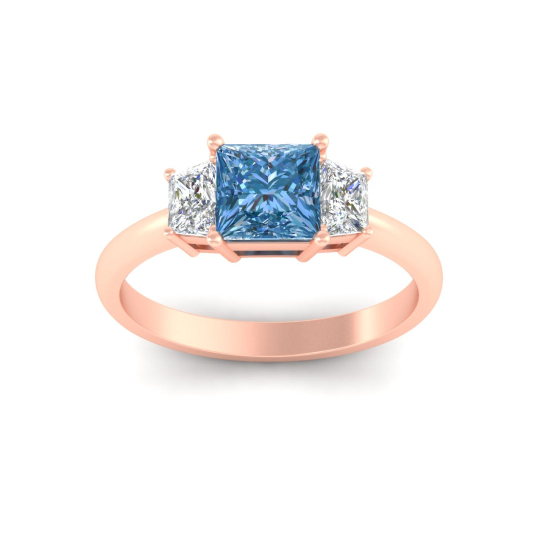 princess-cut-vivid-blue-trapezoid-engagement-ring-in-rose-gold-fdenr7981prgvblueangle5-nl-rg.jpg