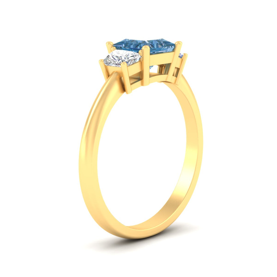princess-cut-vivid-blue-trapezoid-engagement-ring-in-yellow-gold-fdenr7981prgvblueangle2-nl-yg.jpg