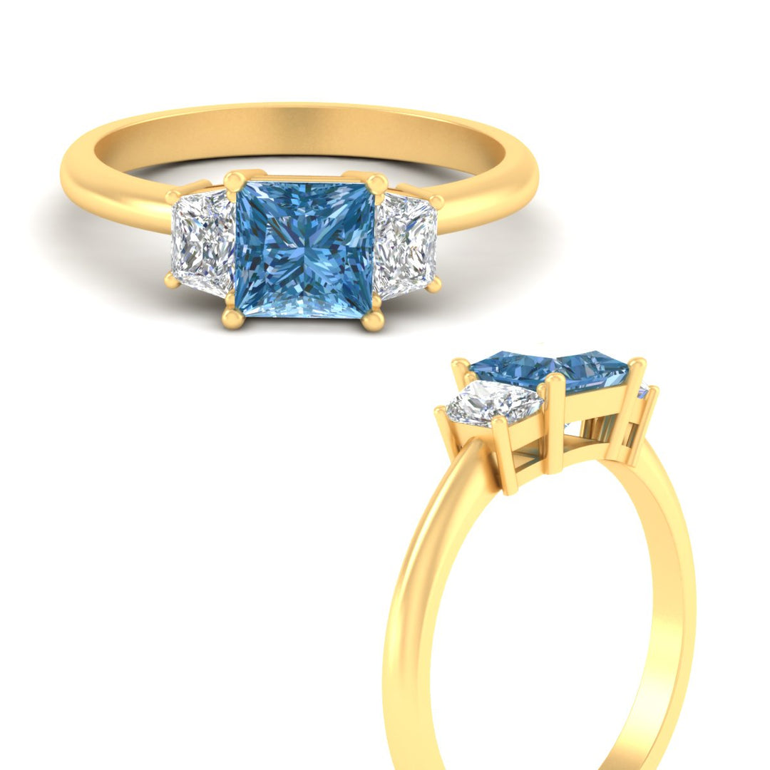 princess-cut-vivid-blue-trapezoid-engagement-ring-in-yellow-gold-fdenr7981prgvblueangle3-nl-yg.jpg