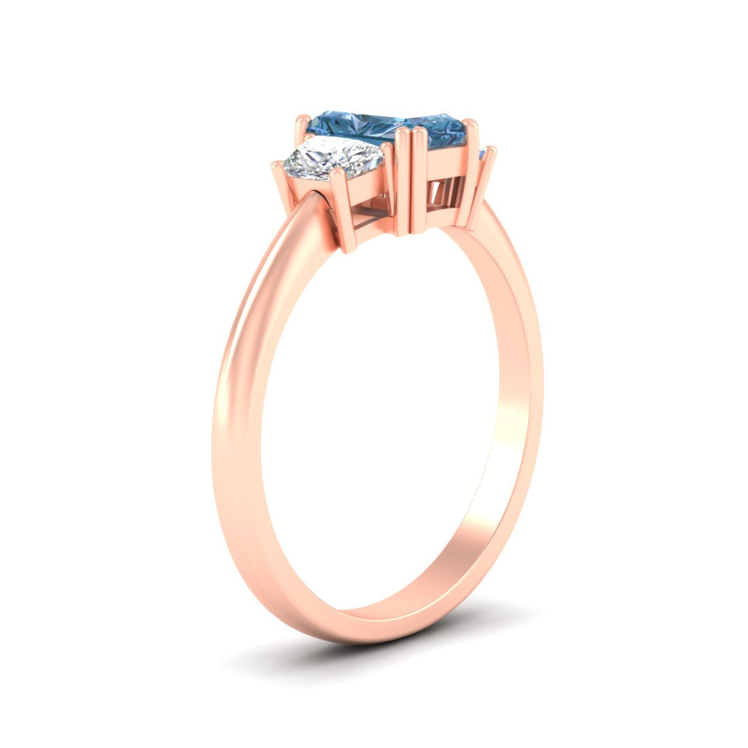 radiant-cut-vivid-blue-trapezoid-engagement-ring-in-rose-gold-fdenr7981ragvblueangle2-nl-rg.jpg