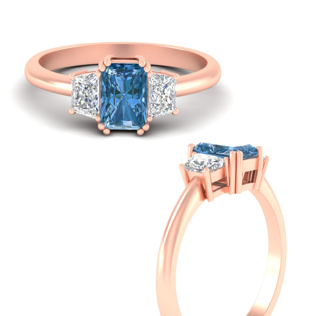 radiant-cut-vivid-blue-trapezoid-engagement-ring-in-rose-gold-fdenr7981ragvblueangle3-nl-rg.jpg