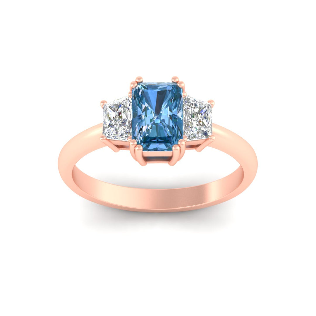 radiant-cut-vivid-blue-trapezoid-engagement-ring-in-rose-gold-fdenr7981ragvblueangle5-nl-rg.jpg