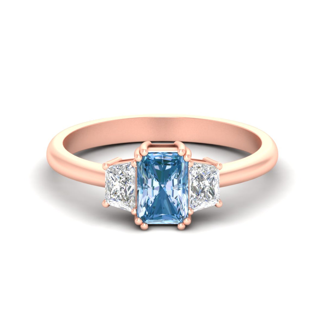 radiant-cut-vivid-blue-trapezoid-engagement-ring-in-rose-gold-fdenr7981ragvbluesleep-nl-rg.jpg