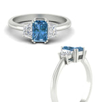 Load image into Gallery viewer, radiant-cut-vivid-blue-trapezoid-engagement-ring-in-white-gold-fdenr7981ragvblueangle3-nl-wg.jpg