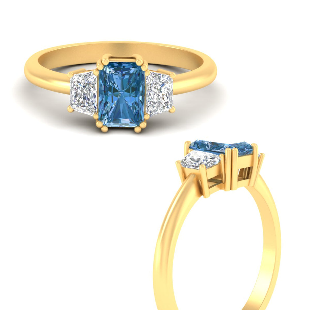 radiant-cut-vivid-blue-trapezoid-engagement-ring-in-yellow-gold-fdenr7981ragvblueangle3-nl-yg.jpg