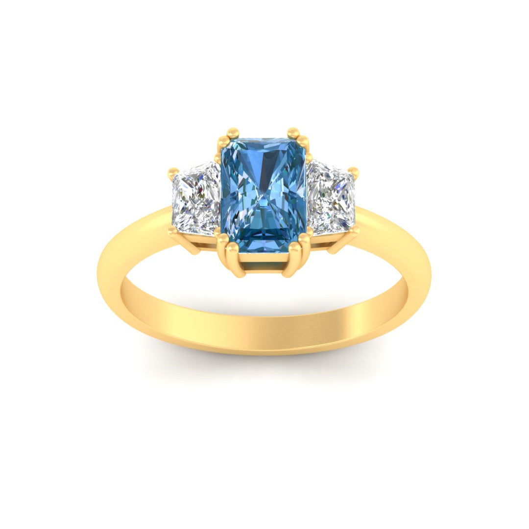 radiant-cut-vivid-blue-trapezoid-engagement-ring-in-yellow-gold-fdenr7981ragvblueangle5-nl-yg.jpg