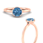 Load image into Gallery viewer, round-cut-collet-set-solitaire-vivid-blue-engagement-ring-in-rose-gold-fdenr11593rogvblueangle3-nl-rg.jpg