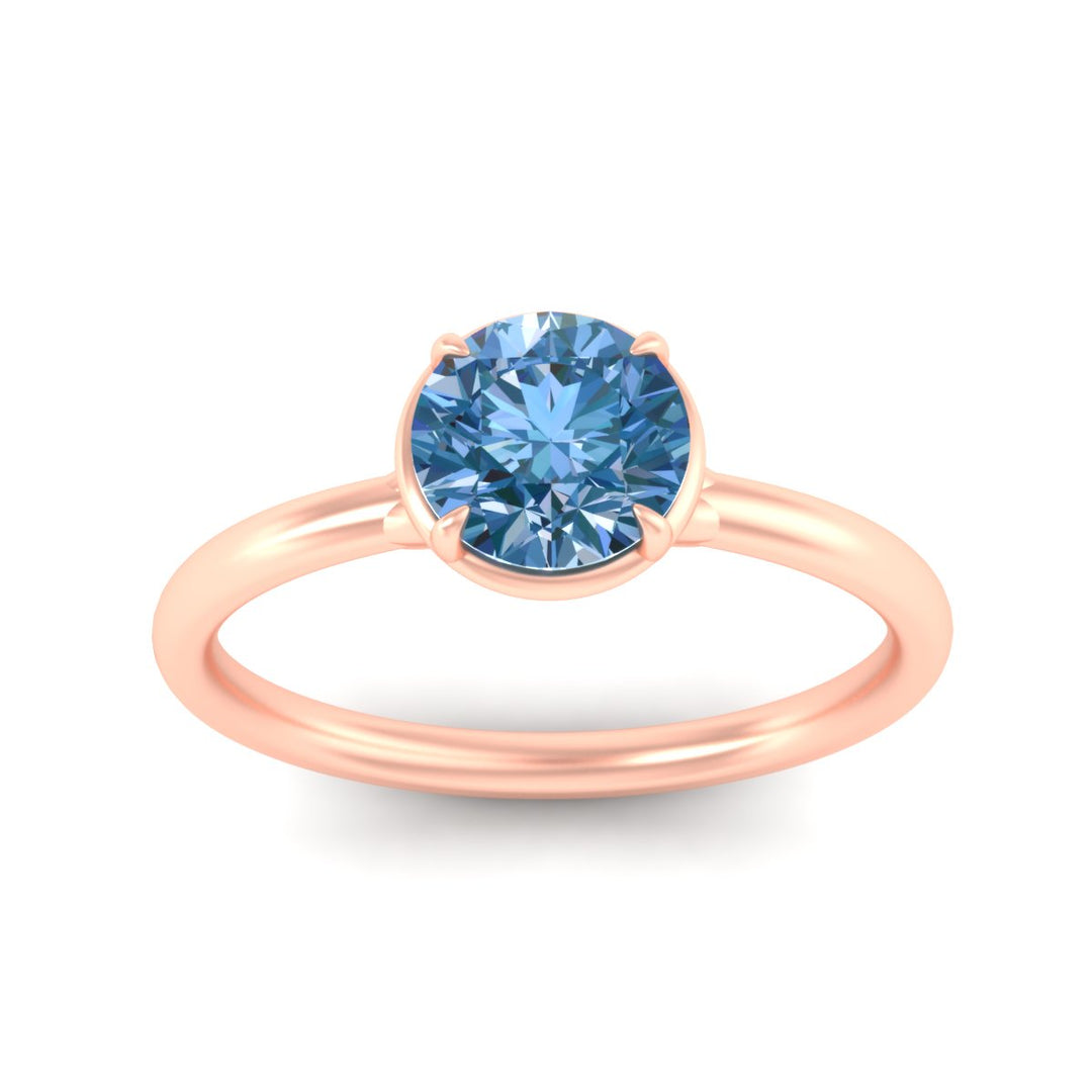 round-cut-collet-set-solitaire-vivid-blue-engagement-ring-in-rose-gold-fdenr11593rogvblueangle5-nl-rg.jpg