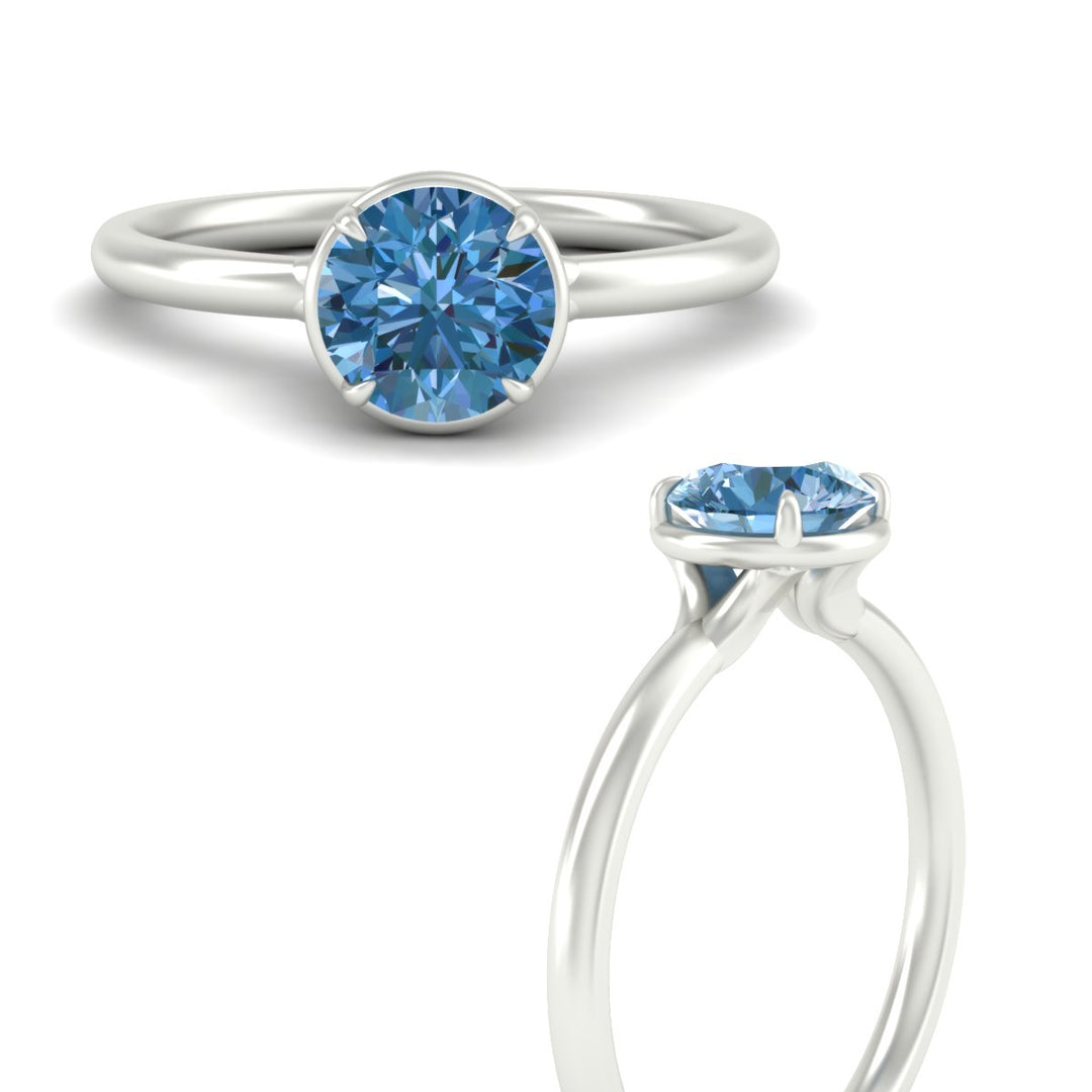round-cut-collet-set-solitaire-vivid-blue-engagement-ring-in-white-gold-fdenr11593rogvblueangle3-nl-wg.jpg