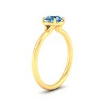 Load image into Gallery viewer, round-cut-collet-set-solitaire-vivid-blue-engagement-ring-in-yellow-gold-fdenr11593rogvblueangle2-nl-yg.jpg