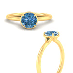 Load image into Gallery viewer, round-cut-collet-set-solitaire-vivid-blue-engagement-ring-in-yellow-gold-fdenr11593rogvblueangle3-nl-yg.jpg
