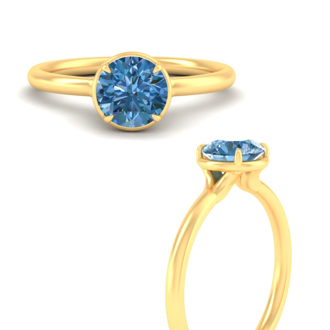 round-cut-collet-set-solitaire-vivid-blue-engagement-ring-in-yellow-gold-fdenr11593rogvblueangle3-nl-yg.jpg