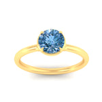 Load image into Gallery viewer, round-cut-collet-set-solitaire-vivid-blue-engagement-ring-in-yellow-gold-fdenr11593rogvblueangle5-nl-yg.jpg