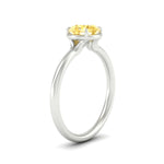 Load image into Gallery viewer, round-cut-collet-set-solitaire-vivid-yellow-engagement-ring-in-white-gold-fdenr11593rogvyellowangle2-nl-wg.jpg