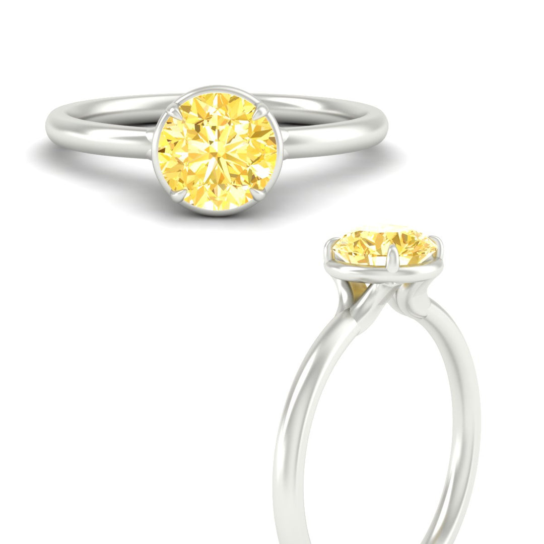 round-cut-collet-set-solitaire-vivid-yellow-engagement-ring-in-white-gold-fdenr11593rogvyellowangle3-nl-wg.jpg