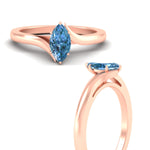Load image into Gallery viewer, twisted-shank-marquise-cut-vivid-blue-solitaire-engagement-ring-in-rose-gold-fdenr1020mqgvblueangle3-nl-rg.jpg