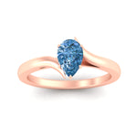 Load image into Gallery viewer, twisted-shank-pear-shaped-vivid-blue-solitaire-engagement-ring-in-rose-gold-fdenr1020pegvblueangle5-nl-rg.jpg
