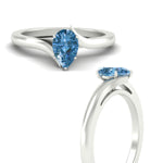 Load image into Gallery viewer, twisted-shank-pear-shaped-vivid-blue-solitaire-engagement-ring-in-white-gold-fdenr1020pegvblueangle3-nl-wg.jpg