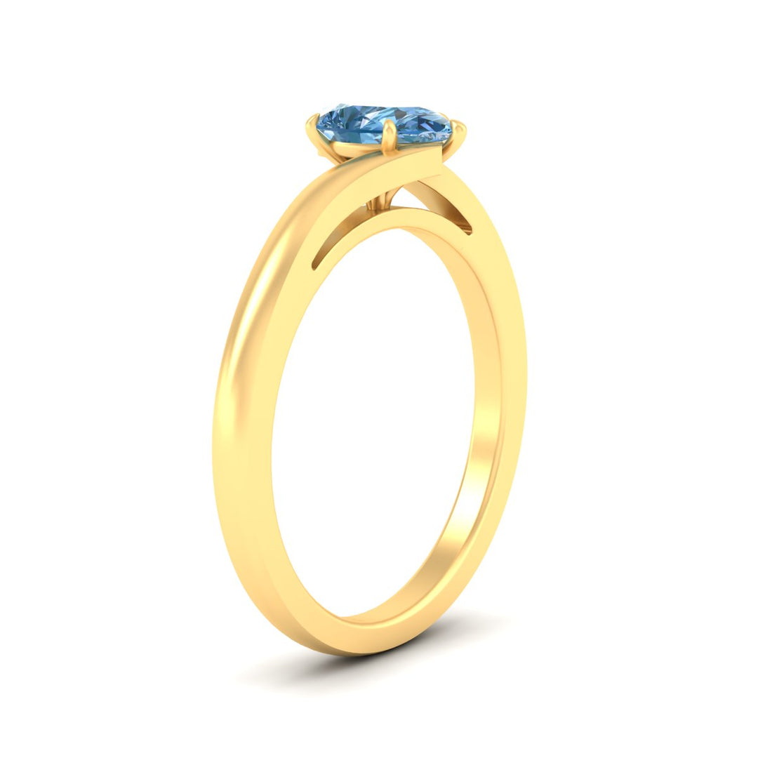twisted-shank-pear-shaped-vivid-blue-solitaire-engagement-ring-in-yellow-gold-fdenr1020pegvblueangle2-nl-yg.jpg