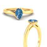 Load image into Gallery viewer, twisted-shank-pear-shaped-vivid-blue-solitaire-engagement-ring-in-yellow-gold-fdenr1020pegvblueangle3-nl-yg.jpg