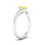 Load image into Gallery viewer, twisted-shank-pear-shaped-vivid-yellow-solitaire-engagement-ring-in-white-gold-fdenr1020pegvyellowangle2-nl-wg.jpg