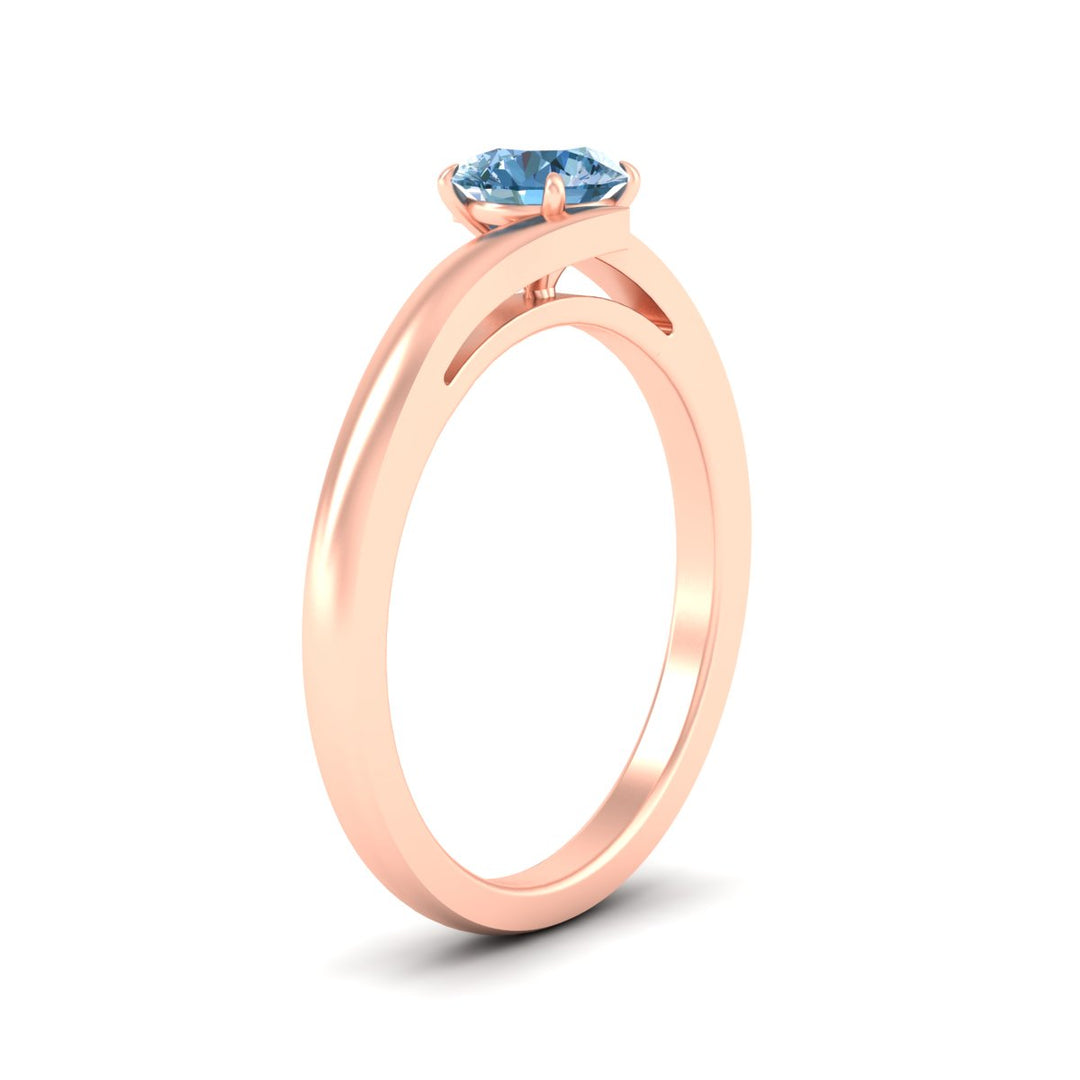 twisted-shank-round-cut-vivid-blue-solitaire-engagement-ring-in-rose-gold-fdenr1020rogvblueangle2-nl-rg.jpg