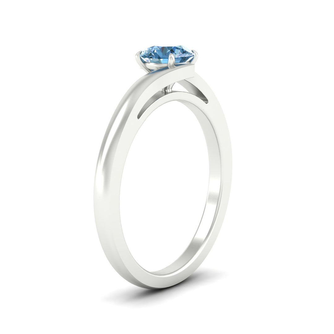 twisted-shank-round-cut-vivid-blue-solitaire-engagement-ring-in-white-gold-fdenr1020rogvblueangle2-nl-wg.jpg