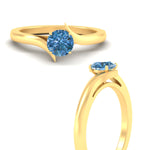 Load image into Gallery viewer, twisted-shank-round-cut-vivid-blue-solitaire-engagement-ring-in-yellow-gold-fdenr1020rogvblueangle3-nl-yg.jpg